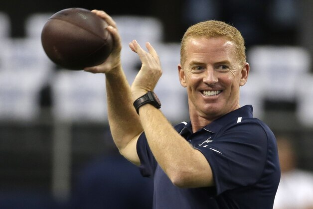 Dallas Cowboys head coach Jason Garrett throws a pass before an NFL football game against the San Francisco 49ers, Sunday, Sept. 7, 2014, in Arlington, Texas. (AP Photo/Tony Gutierrez)