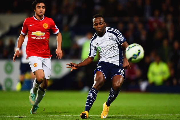 WEST BROMWICH, ENGLAND - OCTOBER 20:  Saido Berahino of West Bromwich Albion scores their second goal as Rafael of Manchester United looks on during the Barclays Premier League match between West Bromwich Albion and Manchester United at The Hawthorns on October 20, 2014 in West Bromwich, England.  (Photo by Laurence Griffiths/Getty Images)
