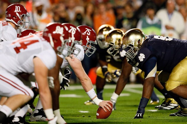 MIAMI GARDENS, FL - JANUARY 07:  AJ McCarron #10 of the Alabama Crimson Tide lines up under his center Barrett Jones #75 against the Notre Dame Fighting Irish during the 2013 Discover BCS National Championship game at Sun Life Stadium on January 7, 2013 in Miami Gardens, Florida.  (Photo by Kevin C. Cox/Getty Images)