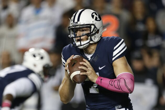 BYU quarterback Christian Stewart looks to pass against Nevada  during the first half of an NCAA college football game in Provo, Utah, Saturday, Oct. 18, 2014. Nevada beat BYU 42-35.  (AP Photo/George Frey)
