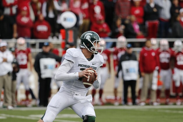 Michigan State quarterback Connor Cook (18) looks to throw in first half action during an NCAA college football game in Bloomington, Ind., Saturday, Oct. 18, 2014. (AP Photo/Sam Riche)