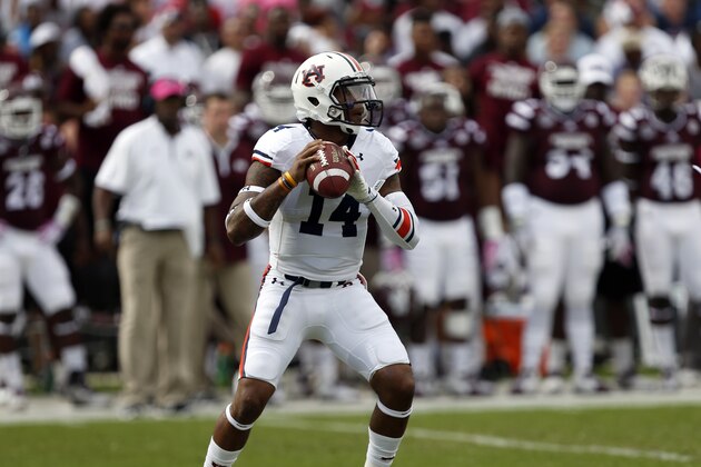 Auburn quarterback Nick Marshall (14) passes against Mississippi State during the first half of an NCAA college football game in Starkville, Miss., Saturday, Oct 11, 2014. No. 3 Mississippi State beat No. 2 Auburn 38-23. (AP Photo/Rogelio V. Solis)