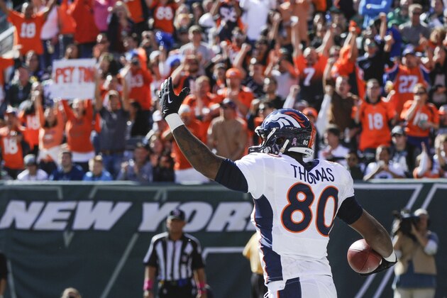 Denver Broncos tight end Julius Thomas (80) reacts after catching a touchdown pass against the New York Jets during the second quarter of an NFL football game, Sunday, Oct. 12, 2014, in East Rutherford, N.J. (AP Photo/Bill Kostroun)
