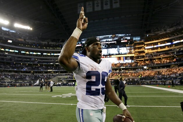 Dallas Cowboys running back DeMarco Murray celebrates their 31-21 win as he walks off the field following their NFL football game agains the New York Giants, Sunday, Oct.  19, 2014, in Arlington, Texas. (AP Photo/Brandon Wade)