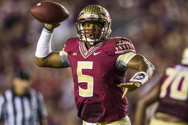 Florida State quarterbacks rolls out to pass in the second half of an NCAA college football game against Notre Dame in Tallahassee, Fla., Saturday, Oct. 18, 2014.Florida State defeated Notre Dame 31-27.  (AP Photo/Mark Wallheiser)