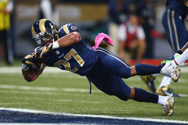 ST. LOUIS, MO - OCTOBER 19: Tre Mason #27 of the St. Louis Rams rushes for a touchdown in the first quarter against the St. Louis Rams at the Edward Jones Dome on October 19, 2014 in St. Louis, Missouri.  (Photo by Dilip Vishwanat/Getty Images)