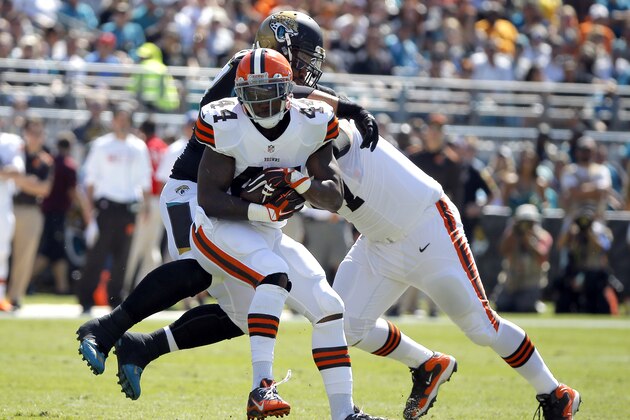 Cleveland Browns running back Ben Tate (44) runs the ball during the first half an NFL football game against the Jacksonville Jaguars, Sunday, Oct. 19, 2014, in Jacksonville, Fla. The Jaguars beat the Browns 24-6.  (AP Photo/Stephen B. Morton)