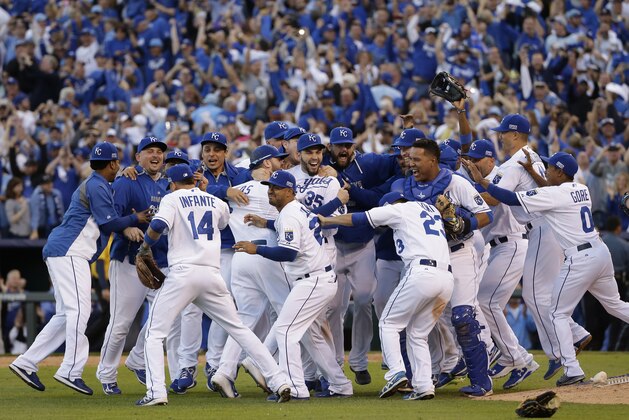 The Kansas City Royals players celebrate after the Royals defeated the Baltimore Orioles 2-1 in Game 4 of the American League baseball championship series Wednesday, Oct. 15, 2014, in Kansas City, Mo. The Royals advance to the World Series.