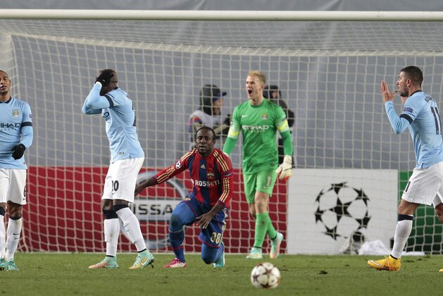 Manchester City players react after referee Istvan Vad awarded a penalty to CSKA during the Champions League Group E soccer match between CSKA Moscow and Manchester City at Arena Khimki stadium in Moscow, Russia, Tuesday Oct. 21, 2014. (AP Photo/Ivan Sekretarev)