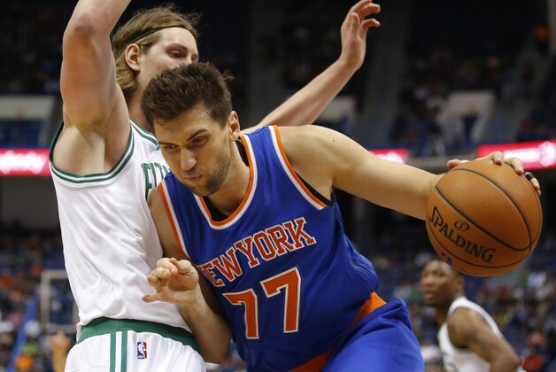 Oct 8, 2014; Hartford, CT, USA; New York Knicks center Andrea Bargnani (77) drives the ball against Boston Celtics center Kelly Olynyk (41) in the first half at XL Center. Mandatory Credit: David Butler II-USA TODAY Sports