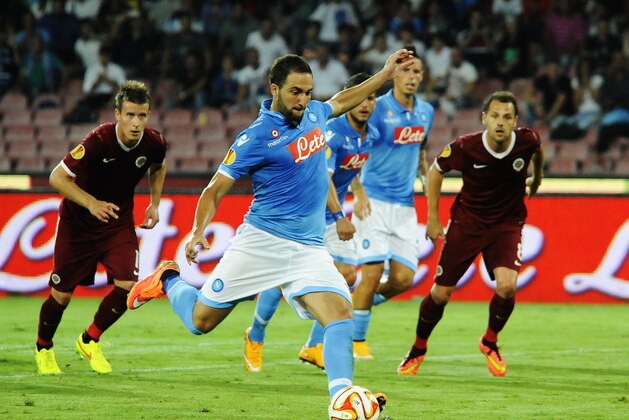 Napoli's Gonzalo Higuain scores on a penalty kick during the Europa League Group I soccer match between Napoli and Sparta Prague, in Naples, Italy, Thursday Sept. 18, 2014. (AP Photo/Salvatore Laporta)