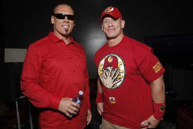 WWE 2K15 cover Superstar John Cena (right) meets with Sting backstage at the SummerSlam Confidential Panel on at Club Nokia, on Saturday, August 16, 2014 in Los Angeles. (Photo by Todd Williamson/Invision for 2K/AP Images)