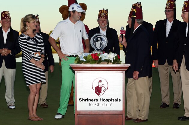 LAS VEGAS, NV - OCTOBER 19:  Ben Martin is presented with the championship trophy after his victory in the Shriners Hospitals For Children Open at TPC Summerlin on October 19, 2014 in Las Vegas, Nevada.  (Photo by Darren Carroll/Getty Images)