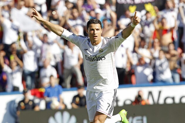 Real Madrid's Cristiano Ronaldo celebrates after scoring against Levante during a Spanish La Liga soccer match at the Ciutat de Valencia stadium in Valencia, Spain, on Saturday, Oct. 18, 2014.(AP Photo/Alberto Saiz)