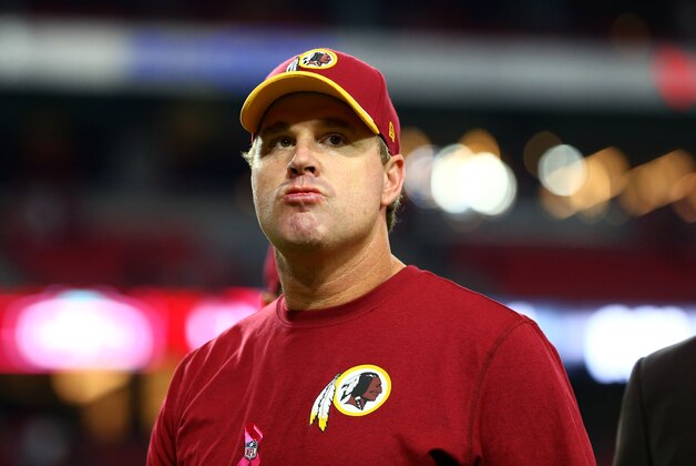 Oct 12, 2014; Glendale, AZ, USA; Washington Redskins head coach Jay Gruden leaves the field following the game against the Arizona Cardinals at University of Phoenix Stadium. The Cardinals defeated the Redskins 30-20. Mandatory Credit: Mark J. Rebilas-USA TODAY Sports