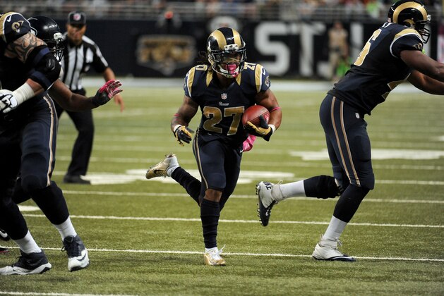 St. Louis Rams running back Tre Mason runs with the ball during the fourth quarter of an NFL football game against the Seattle Seahawks Sunday, Oct. 19, 2014, in St. Louis. (AP Photo/L.G. Patterson)