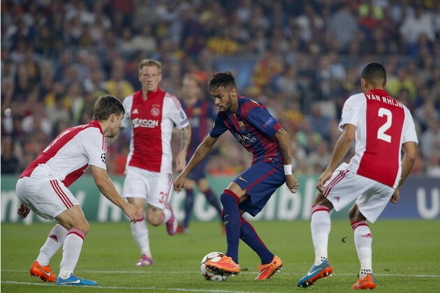 Barcelona's Neymar, 2nd right,  controls the ball during his Champions League group F soccer match between F.C. Barcelona and Ajax at Camp Nou stadium in Barcelona, Spain, Tuesday, Oct. 21, 2014. (AP Photo/Emilio Morenatti)