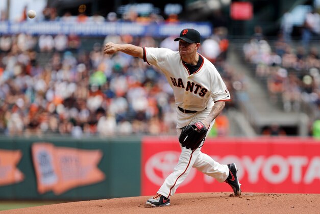 Aug 13, 2014; San Francisco, CA, USA; San Francisco Giants starting pitcher Jake Peavy (22) pitches the ball against the Chicago White Sox during the first inning at AT&T Park. Mandatory Credit: Kelley L Cox-USA TODAY Sports