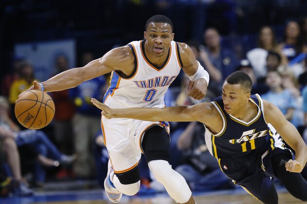 Oklahoma City Thunder guard Russell Westbrook (0) steals the ball from Utah Jazz guard Dante Exum (11) during the first quarter of a preseason NBA basketball game in Oklahoma City, Tuesday, Oct. 21, 2014. (AP Photo/Sue Ogrocki)