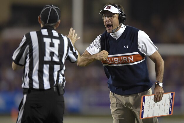 Auburn Tigers head coach Gus Malzahn yells at an official during an NCAA college football game against the Kansas State Wildcats Thursday, Sept. 18, 2014 in Manhattan, Kan. (AP Photo/Reed Hoffmann)