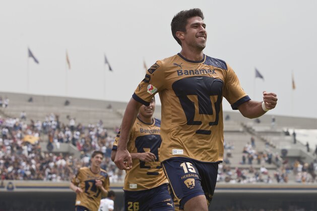 Pumas´ Eduardo Herrera celebrates after scoring during a Mexican soccer league match against Puebla in Mexico City,Sunday, Sept. 30, 2012. (AP Photo/Christian Palma)