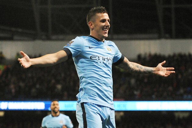 Manchester City's Stevan Jovetic celebrates after scoring his second goal against Liverpool during the English Premier League soccer match between Manchester City and Liverpool at the Etihad Stadium, in Manchester, England, Monday, Aug. 25, 2014. (AP Photo/Rui Vieira)