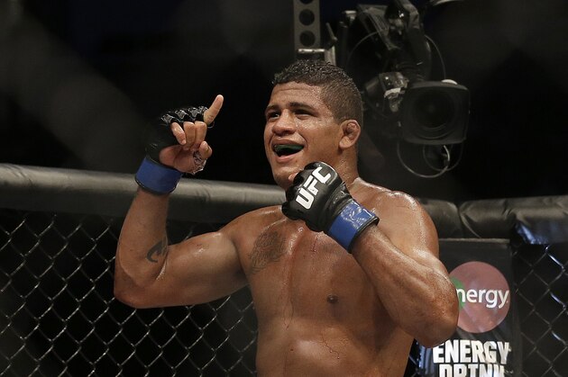 Gilbert Burns celebrates after beating Andreas Stahl by unanimous decision in a welterweight mixed martial arts bout at a UFC on Fox event in San Jose, Calif., Saturday, July 26, 2014. (AP Photo/Jeff Chiu)