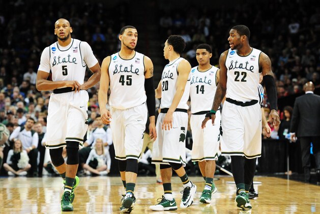 SPOKANE, WA - MARCH 22:  Adreian Payne #5 Denzel Valentine #45 Travis Trice #20 Gary Harris #14 and Branden Dawson #22 of the Michigan State Spartans look on against the Harvard Crimson in the second half during the Third Round of the 2014 NCAA Basketball Tournament at Spokane Veterans Memorial Arena on March 22, 2014 in Spokane, Washington.  (Photo by Steve Dykes/Getty Images)
