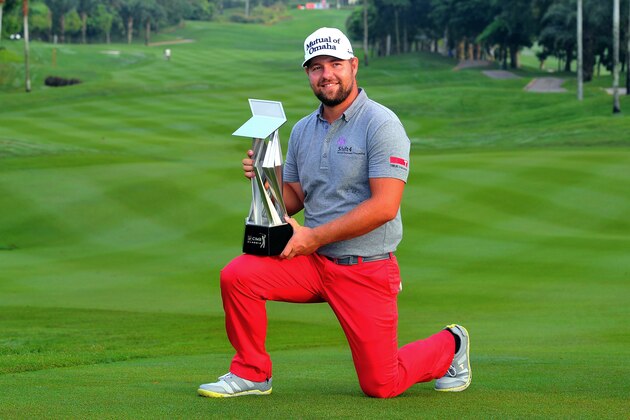 KUALA LUMPUR, MALAYSIA - OCTOBER 28:  Ryan Moore of USA poses with the CIMB Classic Trophy after he won it in a playoff with Gary Woodland of USA during the playoff during the CIMB Classic at Kuala Lumpur Golf & Country Club on October 28, 2013 in Kuala Lumpur, Malaysia.>>  (Photo by Stanley Chou/Getty Images)