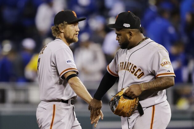 San Francisco Giants right fielder Hunter Pence, left, celebrates with Pablo Sandoval the team's 7-1 victory in Game 1 of baseball's World Series over the Kansas City Royals Tuesday, Oct. 21, 2014, in Kansas City, Mo. (AP Photo/Charlie Neibergall)