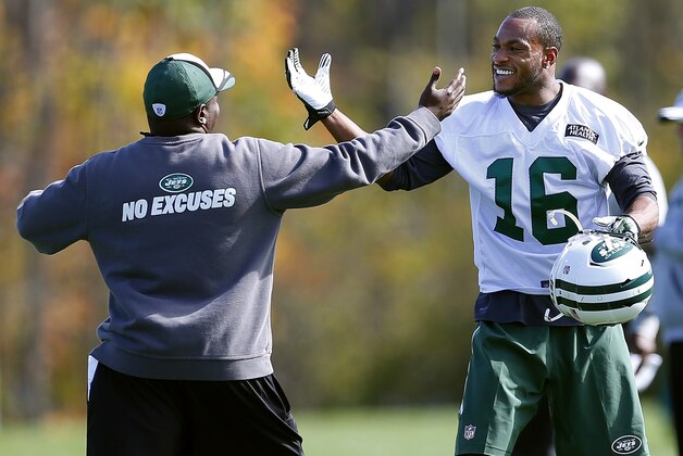 New York Jets wide receiver Percy Harvin (16) is greeted by assistant strength and conditioning coach Aaron McLaurin, left, while working out during NFL football practice in Florham Park, N.J., Monday, Oct. 20, 2014. (AP Photo/Rich Schultz)