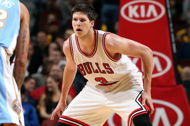 CHICAGO, IL - OCTOBER 13: Doug McDermott #3 of the Chicago Bulls guards his position against the Denver Nuggets on October 13, 2014 at United Center, Chicago, Illinois. NOTE TO USER: User expressly acknowledges and agrees that, by downloading and or using this Photograph, user is consenting to the terms and conditions of the Getty Images License Agreement. Mandatory Copyright Notice: Copyright 2014 NBAE (Photo by Gary Dineen/NBAE via Getty Images)