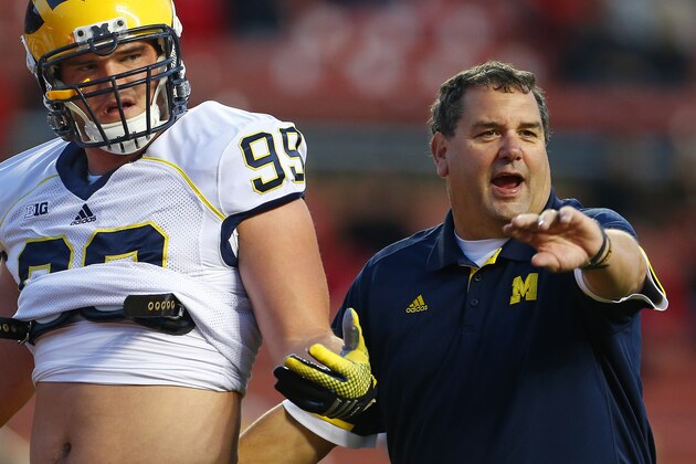 Michigan head coach Brady Hoke Matthew Godin (99) during pre game warmups before their NCAA college football game against Rutgers Saturday, Oct. 4, 2014, in Piscataway, N.J. (AP Photo/Rich Schultz)
