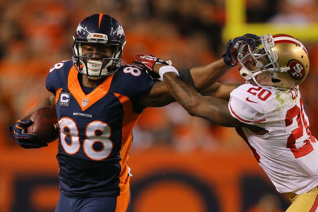 DENVER, CO - OCTOBER 19:  Wide receiver Demaryius Thomas #88 of the Denver Broncos puts a stiff arm on cornerback Perrish Cox #20 of the San Francisco 49ers on a 49-yard reception during a game at Sports Authority Field at Mile High on October 19, 2014 in Denver, Colorado.  (Photo by Justin Edmonds/Getty Images)