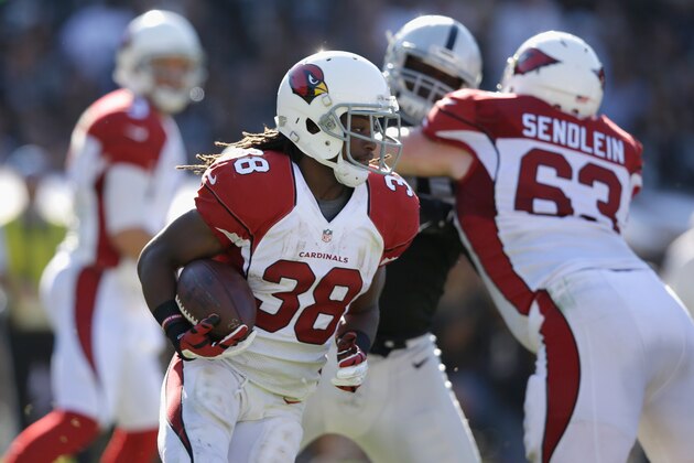 OAKLAND, CA - OCTOBER 19: Andre Ellington #38 of the Arizona Cardinals finds an open path against the Oakland Raiders in the second half at O.co Coliseum on October 19, 2014 in Oakland, California. (Photo by Ezra Shaw/Getty Images)