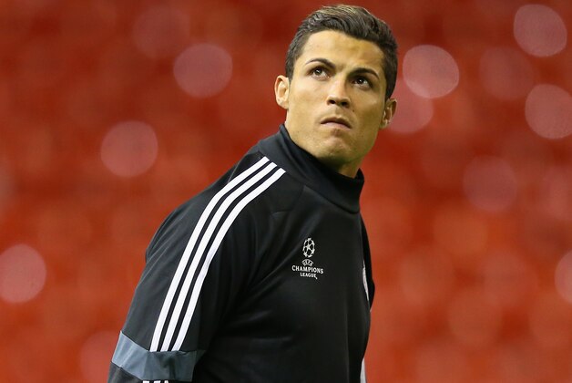 LIVERPOOL, ENGLAND - OCTOBER 21:  Cristiano Ronaldo of Real Madrid CF looks around Anfield as he walks out for a training session at Anfield on October 21, 2014 in Liverpool, United Kingdom.  (Photo by Alex Livesey/Getty Images)