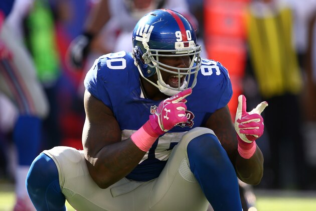 EAST RUTHERFORD, NJ - OCTOBER 05:  Defensive end Jason Pierre-Paul #90 of the New York Giants reacts after a play in the fourth quarter against the Atlanta Falcons during their game at MetLife Stadium on October 5, 2014 in East Rutherford, New Jersey.  (Photo by Elsa/Getty Images)