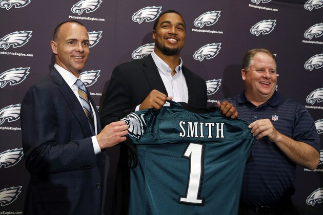 Newly-drafted Philadelphia Eagles' Marcus Smith, center, poses with team president Don Smolenski, left, and head coach Chip Kelly before an NFL football news conference at the team's practice facility, Friday, May 9, 2014, in Philadelphia. Smith was selected in the first round, 26th overall, by the Philadelphia Eagles in the NFL draft on Thursday, May 8. (AP Photo/Matt Slocum)