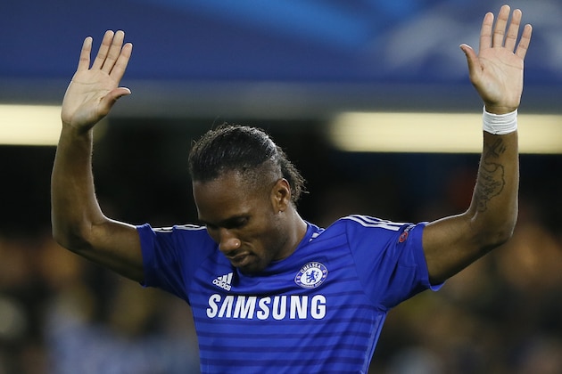 Chelsea's Didier Drogba celebrates after scoring during the Champions League Group G soccer match between Chelsea and NK Maribor at Stamford Bridge stadium in London Tuesday, Oct. 21, 2014. (AP Photo/Kirsty Wigglesworth)