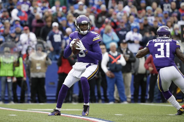 Minnesota Vikings quarterback Teddy Bridgewater (5) looks to pass during the first half of an NFL football game against the Buffalo Bills Sunday, Oct. 19, 2014, in Orchard Park, N.Y.  (AP Photo/Bill Wippert)