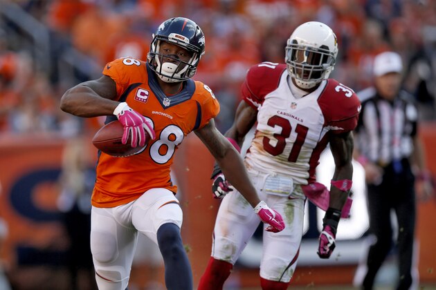 Denver Broncos wide receiver Demaryius Thomas (88) runs as Arizona Cardinals cornerback Antonio Cromartie (31) pursues during the second half of an NFL football game, Sunday, Oct. 5, 2014, in Denver. (AP Photo/David Zalubowski)