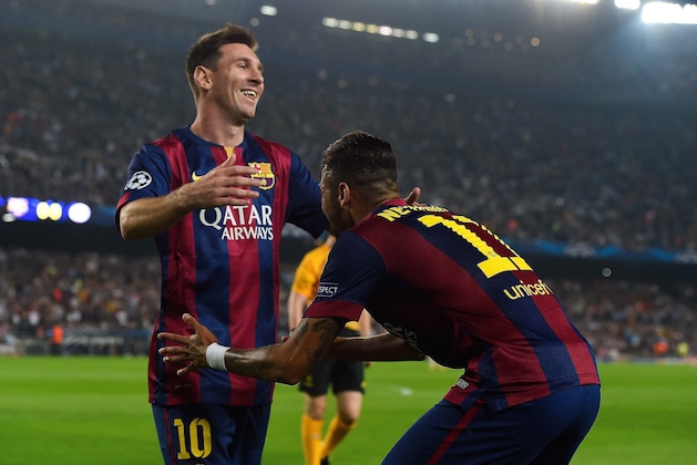 BARCELONA, SPAIN - OCTOBER 21:  Neymar (R) celebrates with his teammate Lionel Messi after scoring the opening goal of FC Barcelonaa UEFA Champions League Group F match between FC Barcelona and AFC Ajax at the Camp Nou Stadium on October 21, 2014 in Barcelona, Spain.  (Photo by David Ramos/Getty Images)