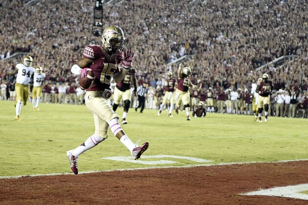 Oct 18, 2014; Tallahassee, FL, USA; Florida State Seminoles wide receiver Travis Rudolph (15) walks into the end zone for a touchdown against the Notre Dame Fighting Irish during the first quarter at Doak Campbell Stadium. Mandatory Credit: John David Mercer-USA TODAY Sports