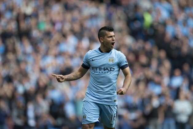 Manchester City's Sergio Aguero celebrates after scoring his third goal against Tottenham during the English Premier soccer match between Manchester City and Tottenham Hotspur at the Etihad Stadium, Manchester, England, Saturday Oct. 18, 2014. (AP Photo/Jon Super)