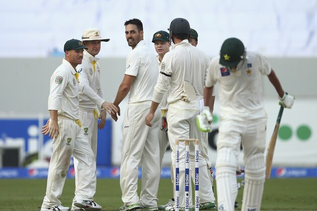 DUBAI, UNITED ARAB EMIRATES - OCTOBER 22:  Mitchell Johnson of Australia celebrates after taking the wicket of Younis Khan of Pakistan during Day One of the First Test between Pakistan and Australia at Dubai International Stadium on October 22, 2014 in Dubai, United Arab Emirates.  (Photo by Ryan Pierse/Getty Images)