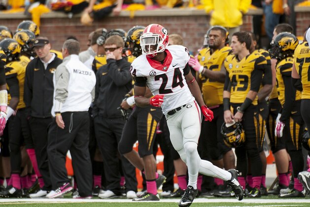 Georgia defensive back Dominick Sanders celebrates after intercepting a Missouri pass during the third quarter of an NCAA college football game Saturday, Oct. 11, 2014, in Columbia, Mo. Georgia won the game 34-0. (AP Photo/L.G. Patterson)