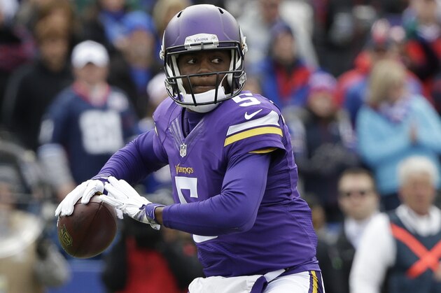 Minnesota Vikings quarterback Teddy Bridgewater (5) looks to pass during the first half of an NFL football game against the Buffalo Bills Sunday, Oct. 19, 2014, in Orchard Park, N.Y.  (AP Photo/Bill Wippert)