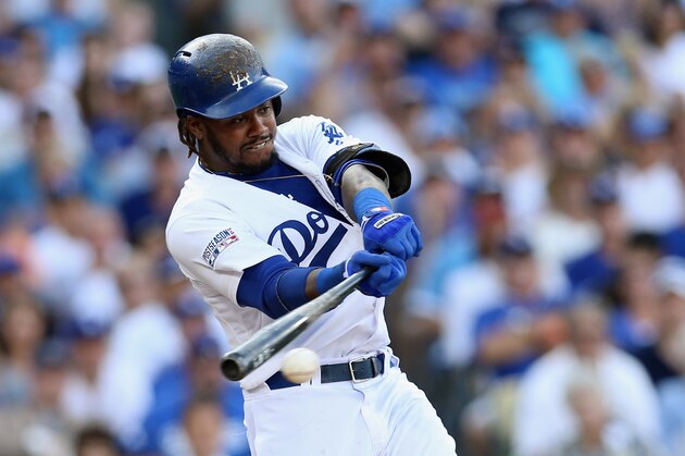 LOS ANGELES, CA - OCTOBER 03:  Hanley Ramirez #13 of the Los Angeles Dodgers singles to knock in Yasiel Puig #66 in the third inning of Game One of the National League Division Series at Dodger Stadium on October 3, 2014 in Los Angeles, California.  (Photo by Stephen Dunn/Getty Images)