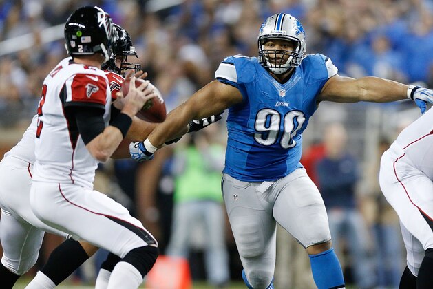 DETROIT, MI - DECEMBER 22:  Ndamukong Suh #90 of the Detroit Lions rushes Matt Ryan #2 of the Atlanta Falcons during the third quarter at Ford Field on December 22, 2012 in Detroit, Michigan. Atlanta won the game 31-18. (Photo by Gregory Shamus/Getty Images)
