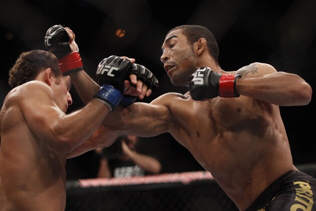 Defending featherweight champion Jose Aldo, from Brazil, right, punches Chad Mendes, from the US, during their featherweight title bout at the Ultimate Fighting Championship (UFC) 142 in Rio de Janeiro, Brazil, Sunday Jan. 15, 2012. Aldo defended his belt defeating Mendes on the first round. (AP Photo/Felipe Dana) Defending featherweight champion Jose Aldo, from Brazil, right, punches Chad Mendes, from the US, during their featherweight title bout at the Ultimate Fighting Championship (UFC) 142 in Rio de Janeiro, Brazil, Sunday Jan. 15, 2012. Aldo defended his belt defeating Mendes on the first round. (AP Photo/Felipe Dana)